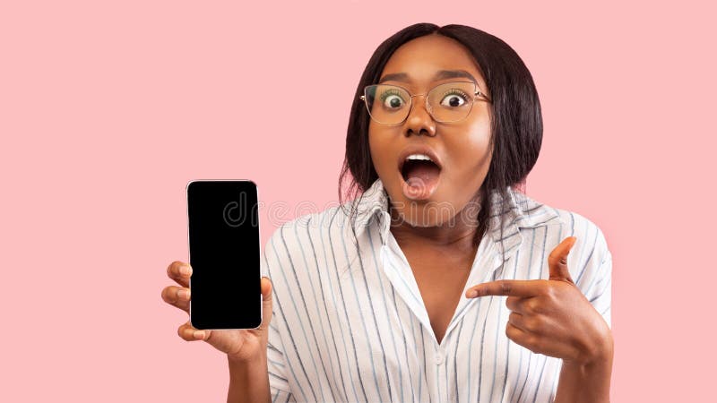 Excited African American Girl Holding Phone Pointing Finger, Studio, Mockup