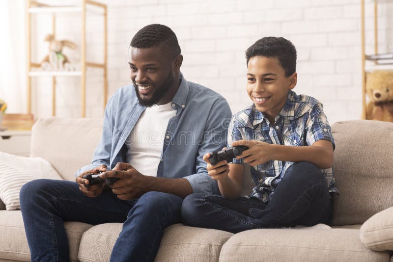 Playing video game Stock Photos, Royalty Free Playing video game