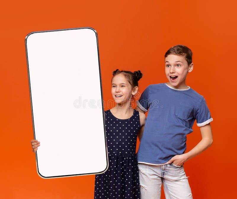 Excited Boy And Girl Holding Blank Smartphone With White Screen For Mockup