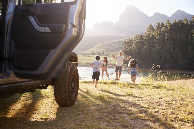 Excited Family Reaching Countryside Destination On Road Trip stock image