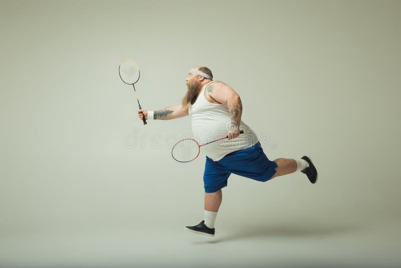 Excited Fat Man Having Fun with Badminton Stock Image - Image of equipment, excited: