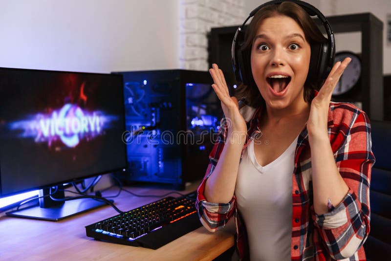 Excited Girl Gamer Sitting at the Table, Playing Online Games Stock Image -  Image of headset, esports: 136171701