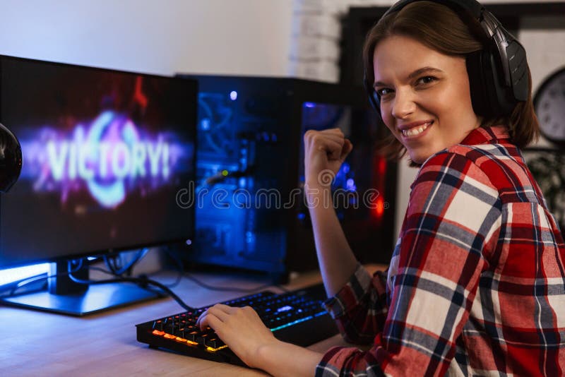 Excited Girl Gamer Sitting at the Table, Playing Online Games Stock Image -  Image of headset, esports: 136171701