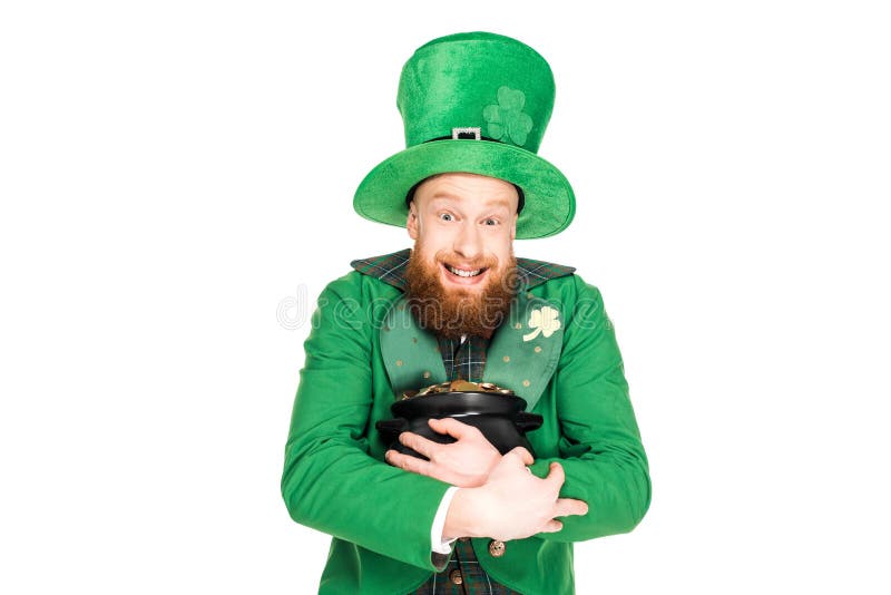 Excited leprechaun in green hat holding pot of gold