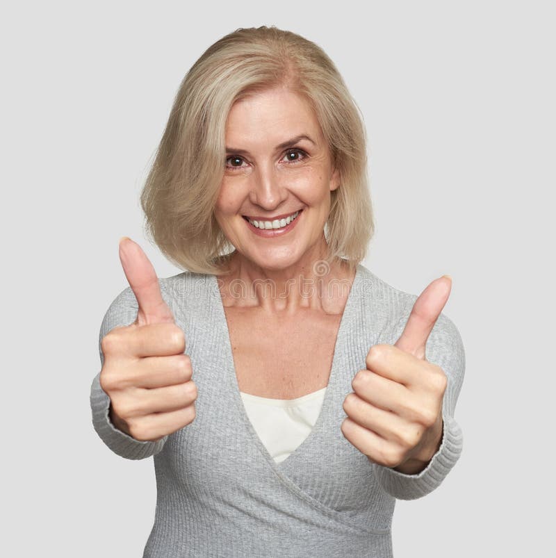 Excited mature woman showing thumbs up royalty free stock image Excited mature woman showing thumbs up royalty free stock image