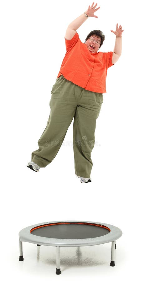 Excited Obese Forties Woman Jumping on Trampoline royalty free stock images Excited Obese Forties Woman Jumping on Trampoline royalty free stock images