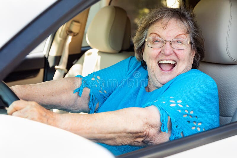 Excited Senior Woman Driving New Car royalty free stock images Excited Senior Woman Driving New Car royalty free stock images