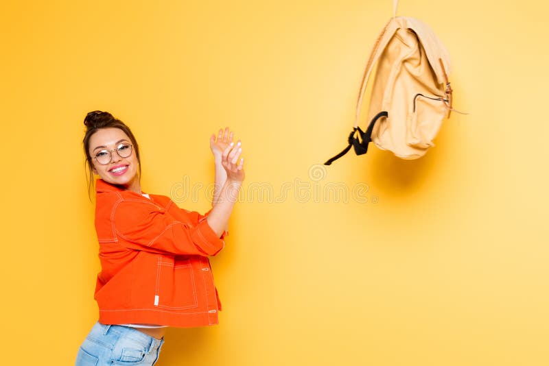 Student Throwing Backpack while Smiling at Stock Photo - Image of  eyeglasses, trowing: 176603332