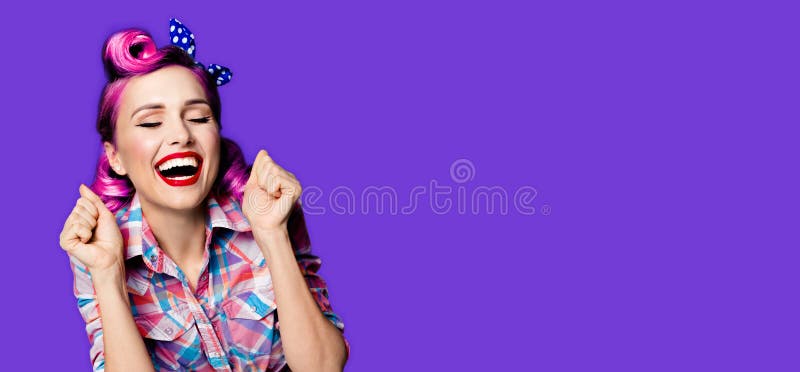 Unbelievable news! Excited surprised, very happy purple woman. Pin up girl with open mouth and closed eyes with raised hands. Retro and vintage concept. Violet color background. Wide composition image. Unbelievable news! Excited surprised, very happy purple woman. Pin up girl with open mouth and closed eyes with raised hands. Retro and vintage concept. Violet color background. Wide composition image