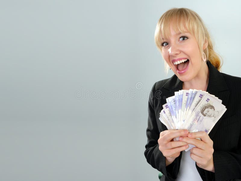 Excited woman with British currency