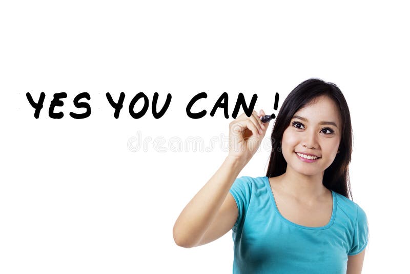 Excited woman writes motivation word royalty free stock photo