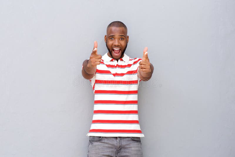 Excited young african man pointing