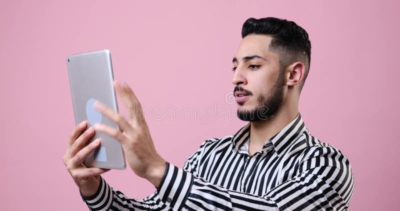 Excited young businessman using digital tablet stock footage