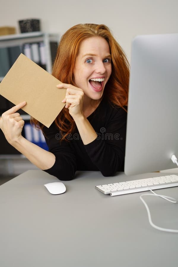 Excited young woman with a blank brown card stock images Excited young woman with a blank brown card stock images