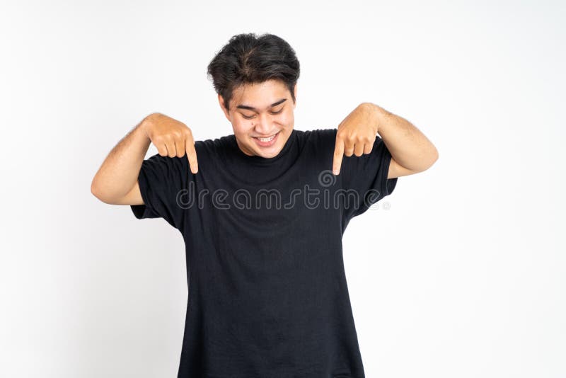 excited young man with fingers pointing down