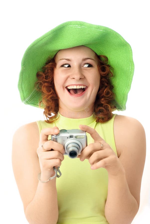 Excited young woman with a camera