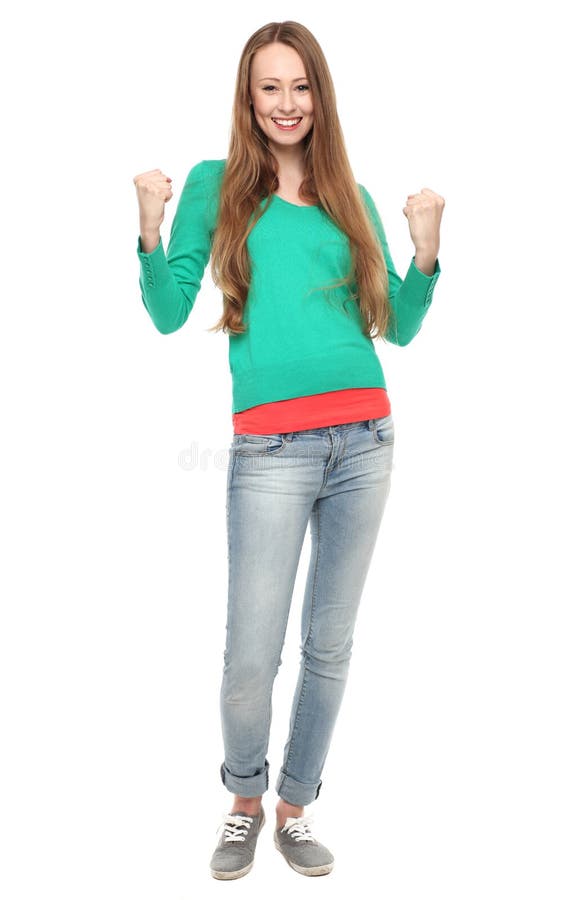 Excited young woman clenching fists stock photos
