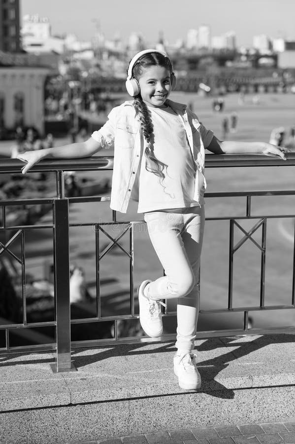 Exciting journeys through cities and museums. City guide and audio tour. Girl little tourist kid using audio guide stock images Exciting journeys through cities and museums. City guide and audio tour. Girl little tourist kid using audio guide stock images