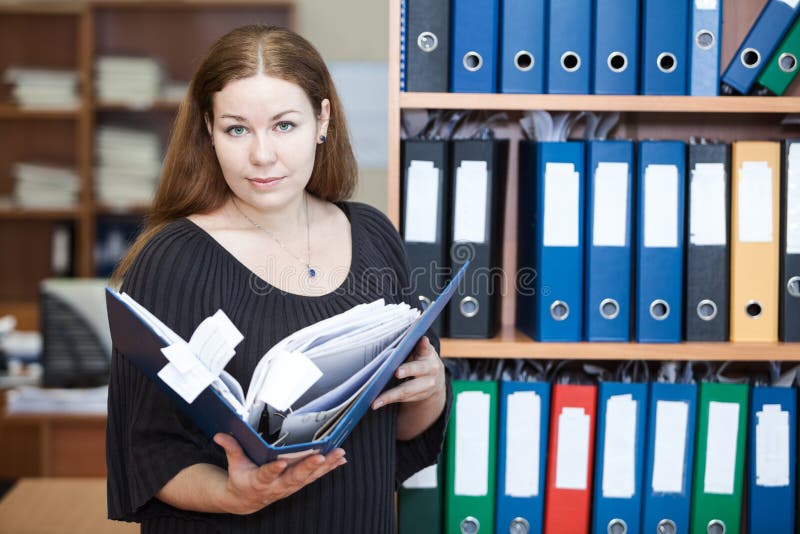 Executive business woman holding documents