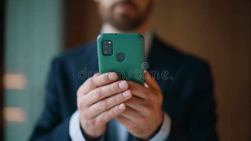 Executive hands holding mobile phone at company workspace closeup. Elegant man stock footage