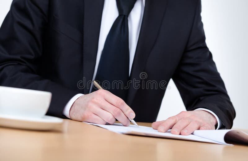 Executive making notes in the notebook royalty free stock photo