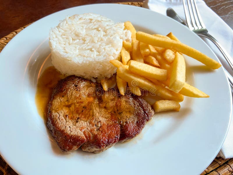 Executive Steak Dish with French Fries and Rice. Traditional Brazilian