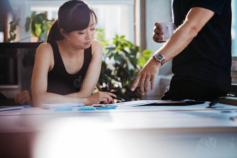 Executives discussing new business ideas in office stock photography Executives discussing new business ideas in office stock photography