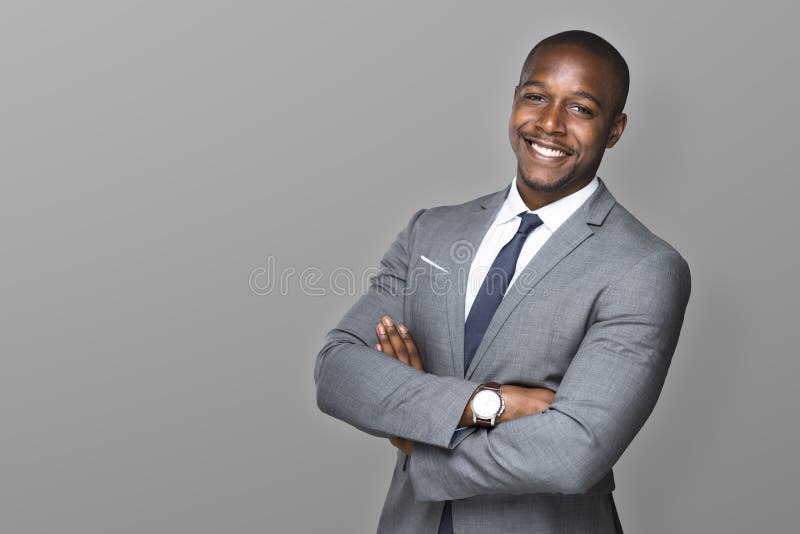 Executivo profissional de sorriso feliz considerável atrativo do homem de negócios com um terno e um laço à moda foto de stock royalty free Executivo profissional de sorriso feliz considerável atrativo do homem de negócios com um terno e um laço à moda foto de stock royalty free