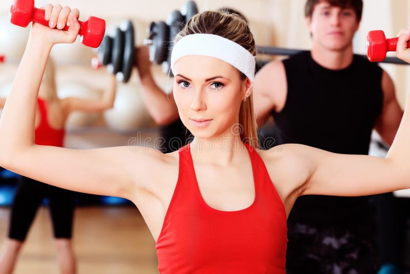 Exercise with dumbbells stock photo. Image of female - 12704824