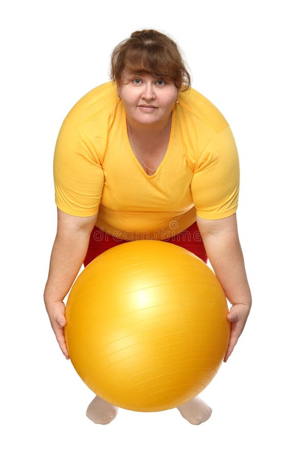 Exercising overweight woman with ball royalty free stock photo