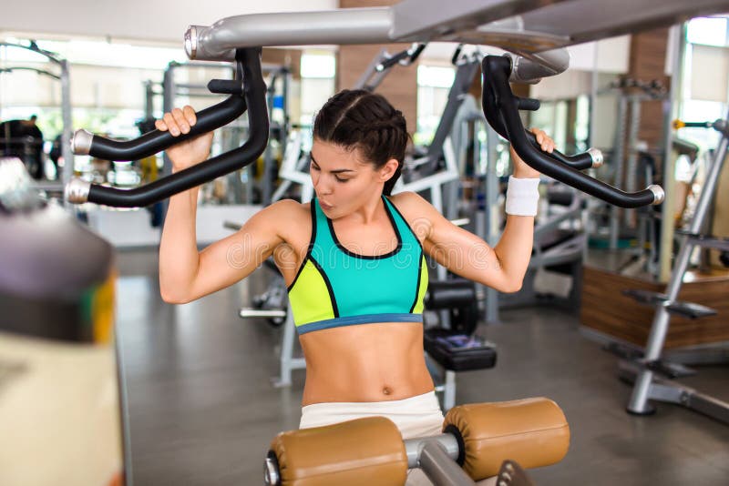 Exercising on Shoulder Press Machine Stock Photo - Image of indoors ...