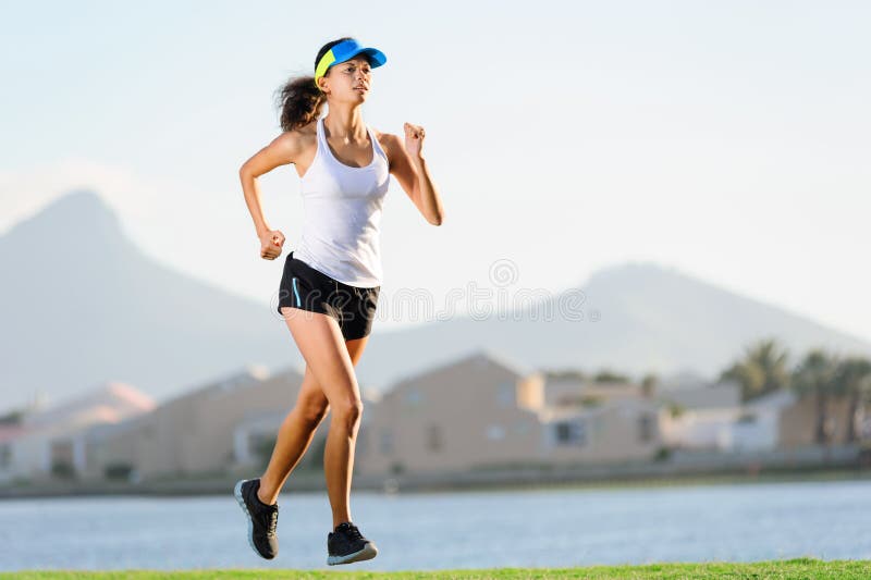 Healthy active female runner training outdoors for marathon. fitness woman lifestyle. Healthy active female runner training outdoors for marathon. fitness woman lifestyle