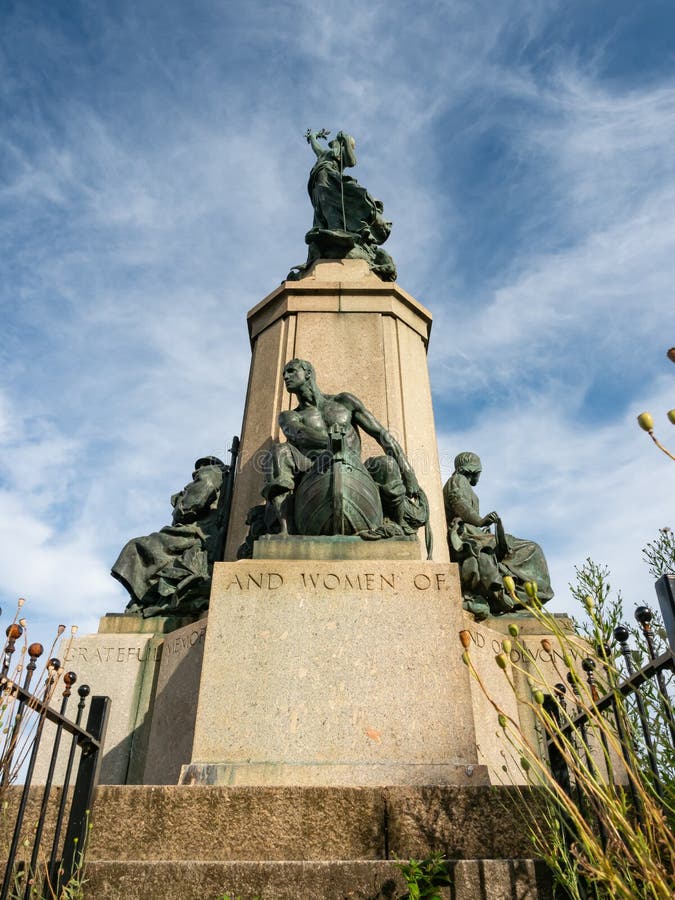 EXETER, DEVON, UK - August 3 2021: Side view of Exeter War Memorial in Northernhay Gardens.  The lower nearest statue depicts a sailor on the hull of a ship. EXETER, DEVON, UK - August 3 2021: Side view of Exeter War Memorial in Northernhay Gardens.  The lower nearest statue depicts a sailor on the hull of a ship