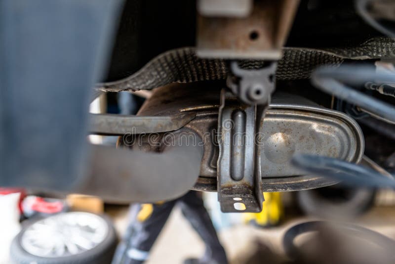 The Exhaust System in the Car Seen from Below, the Car is on the Lift
