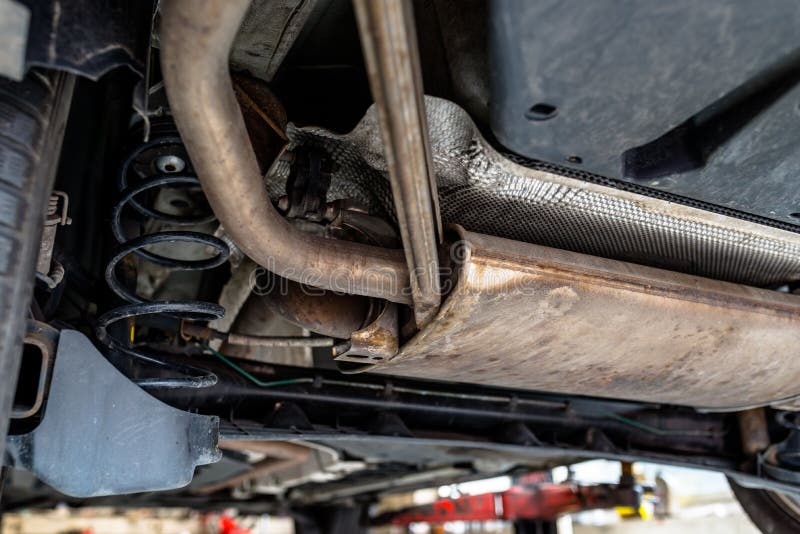 The Exhaust System in the Car Seen from Below, the Car is on the Lift