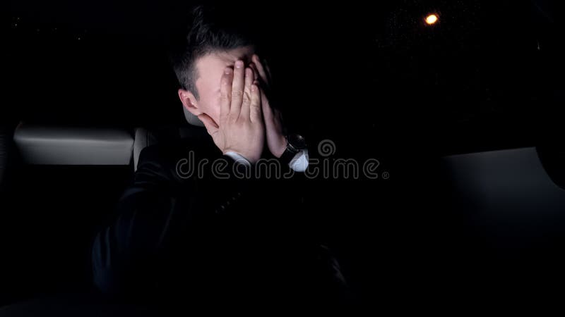 Exhausted business man driving home after stressful meeting, work problems royalty free stock image Exhausted business man driving home after stressful meeting, work problems royalty free stock image