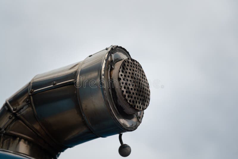 An exhausted pipe of heavy machine engine and power generator. Industrial equipment object photo. Flame arrester stock images, royalty-free photos and pictures