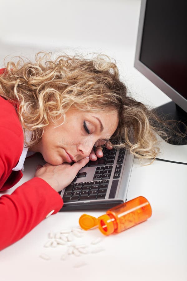 Exhausted woman asleep at work