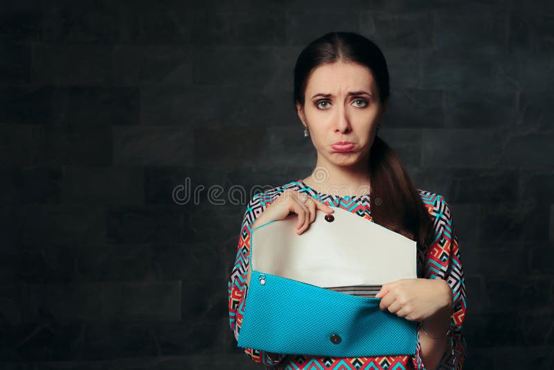 Exigent fashion girl looking to see if the purse is a fake replica. Exigent fashion girl looking to see if the purse is a fake replica