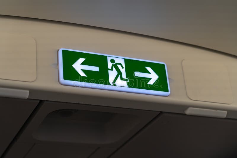 Exit lightbox signage on airplane, escape way of life. way to survive concept. Exit signage stock images, royalty-free photos and pictures