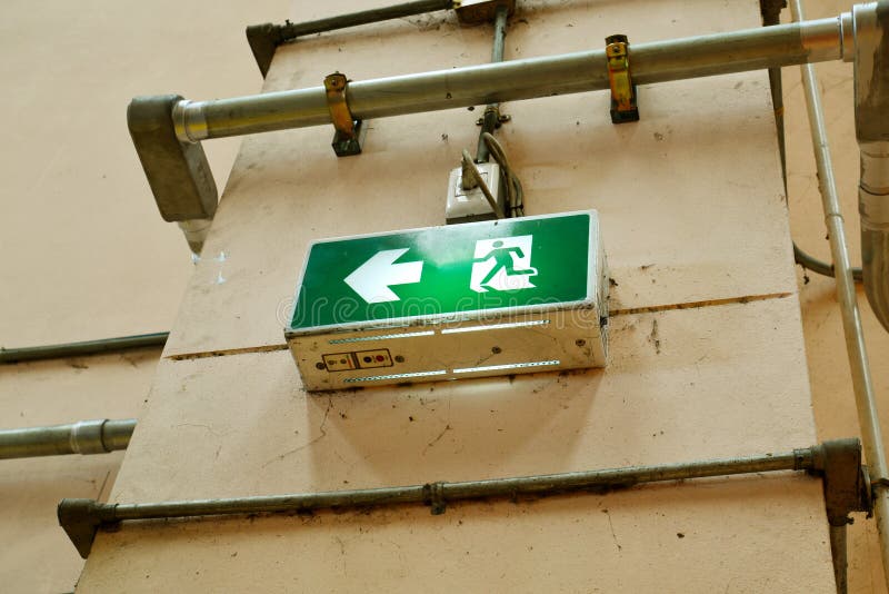 Exit sign fire alarm on brick wall royalty free stock photography Exit sign fire alarm on brick wall royalty free stock photography