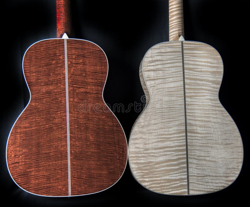 Exotic, rare and figured wood on the backs of acoustic guitars - flamed maple figured tiger mahogany stock images Exotic, rare and figured wood on the backs of acoustic guitars - flamed maple figured tiger mahogany stock images