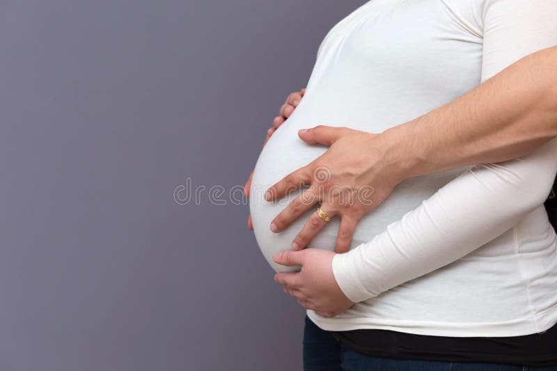 Expectant Parents Holding Growing Baby Bump Stock Image Image Of