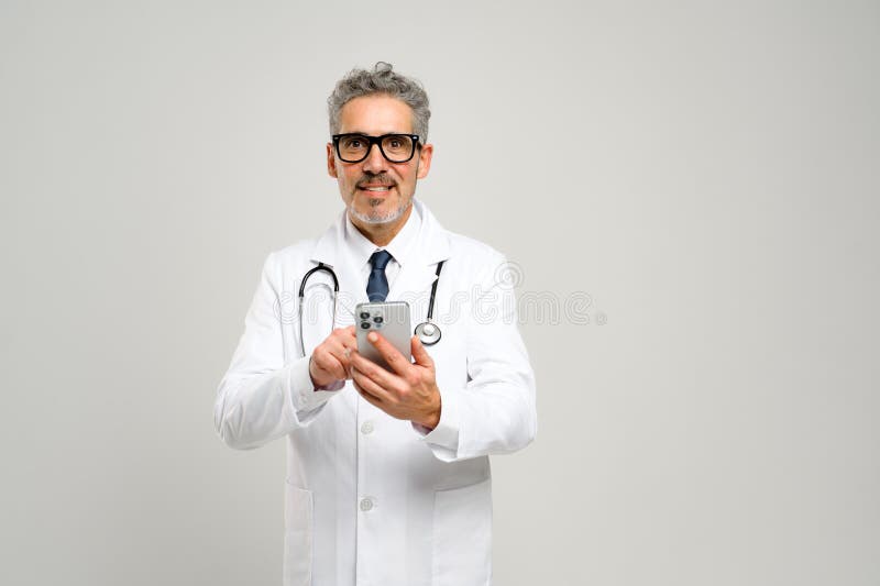 Experienced confident senior doctor with grey hair isolated royalty free stock images