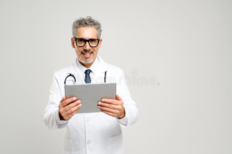 Experienced confident senior doctor with grey hair isolated royalty free stock image