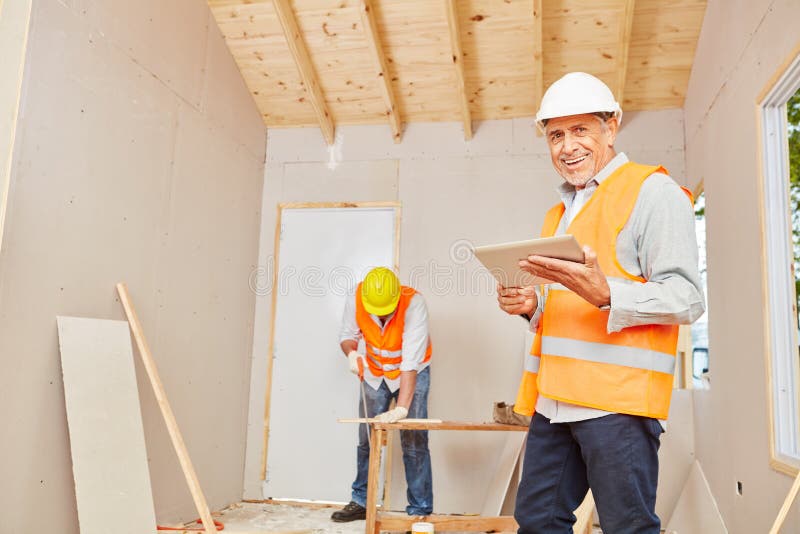Experienced craftsman with carpenter stock photography Experienced craftsman with carpenter stock photography