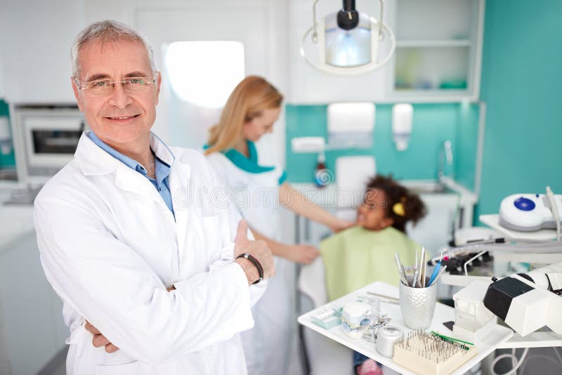 Experienced Dentist in Dental Practice Stock Photo Image of female