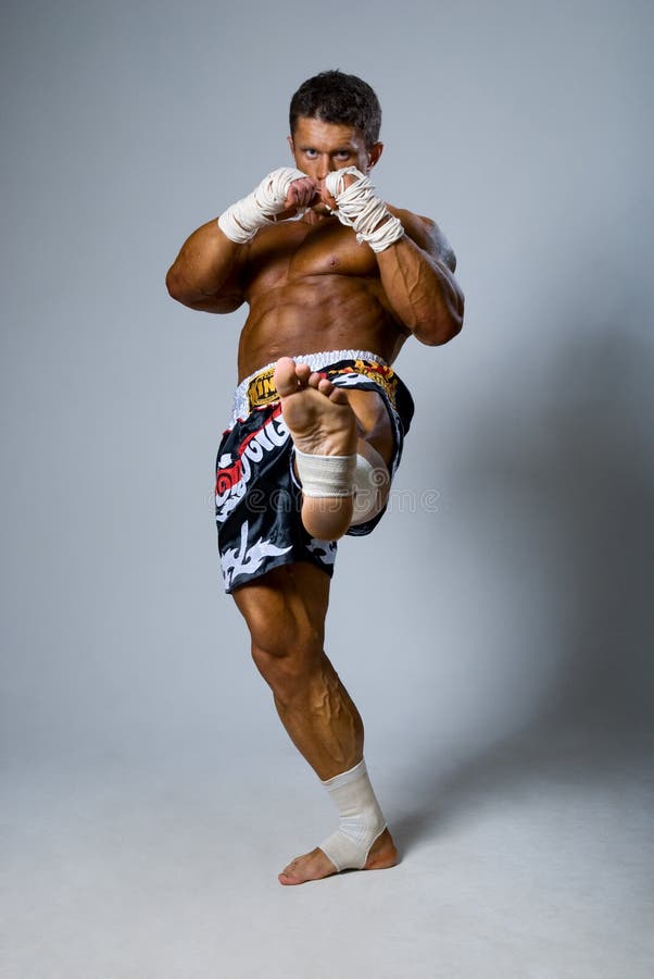 Experienced Fighter Punches during Training. Kickboxing or Muay Stock