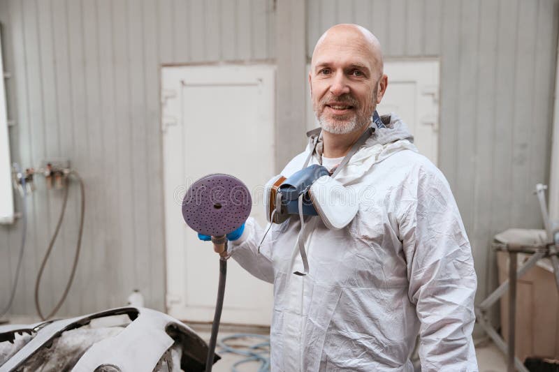 Experienced Master of the Paint Shop is at the Workplace Stock Photo