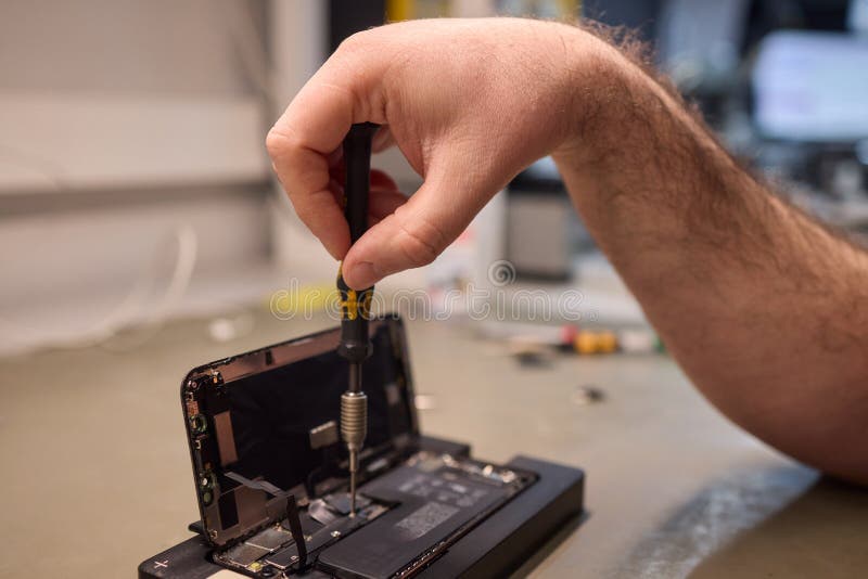 Expert Smartphone Repair Using Advanced Precision Tools for Optimal Performance and Quality stock image